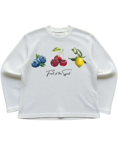 White long-sleeve shirt with colorful fruit illustrations on a white background